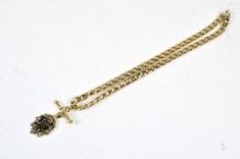 A gold plated curb link chain with attached T-bar and a gilt silver fob