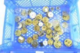 A collection of 19th century and late pocket watch movements and dials,
