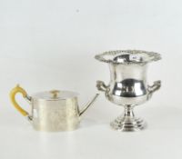 A contemporary silver plated wine cooler and a Georgian style white metal teapot,