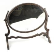 An early 20th century oak dressing table swing mirror,