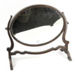 An early 20th century oak dressing table swing mirror,