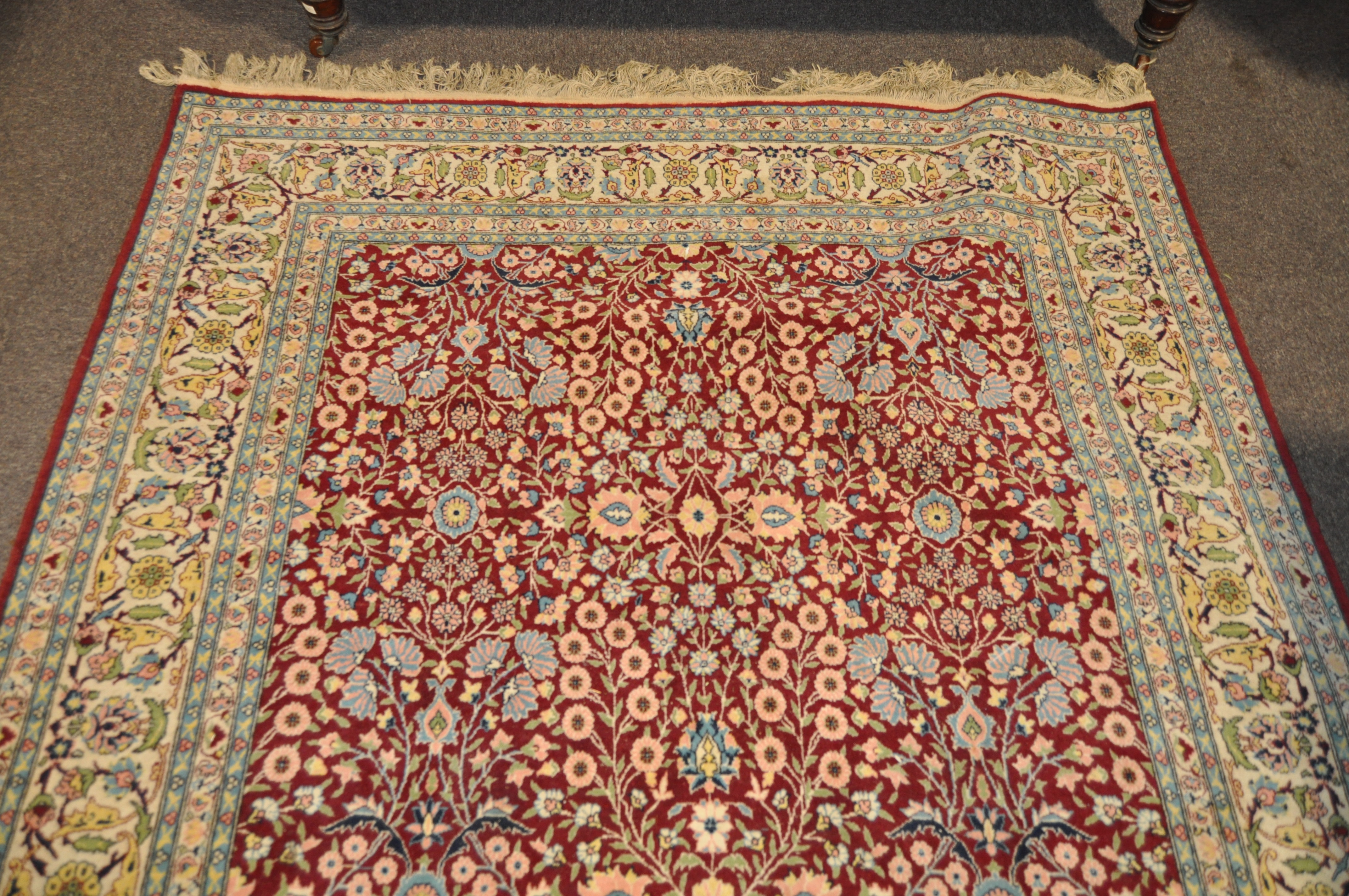 A 20th century Turkish rug, woven with dense flowers on a dark red ground, - Image 6 of 7