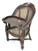 A late 19th/early 20th century child's chair with Bergere seat and back,