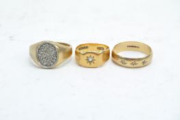 Three diamond set gold rings, including a 9ct gold signet ring,