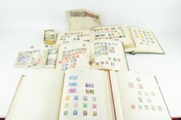 Six vintage stamp albums containg British and World examples together with many loose examples