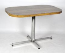 A contemporary veneered table of rectangular form with rounded edges, raised upon chromed base,