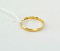 A 22ct gold wedding band,