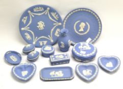 A collection of Wedgwood blue and white jasperware, to include a vase, lidded trinket boxes,