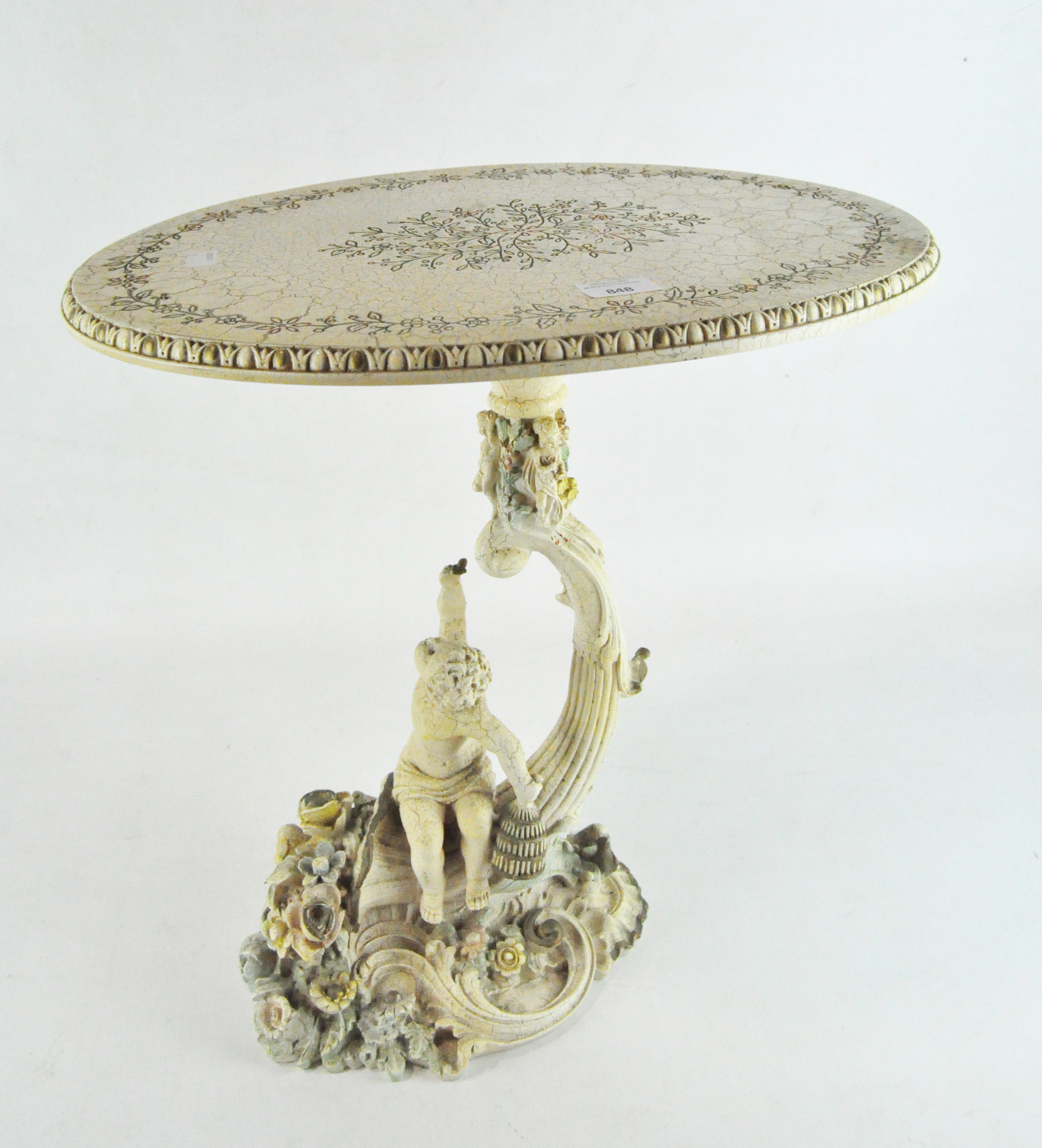 A white resin occasional table with cherub cast base