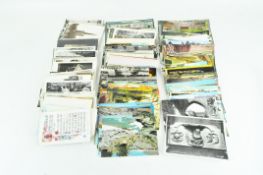 A large selection of vintage postcards, most being of topographical interest,