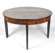 A late 19th/early 20th century mahogany dining table