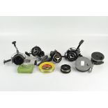 A collection of fishing reels and weights,