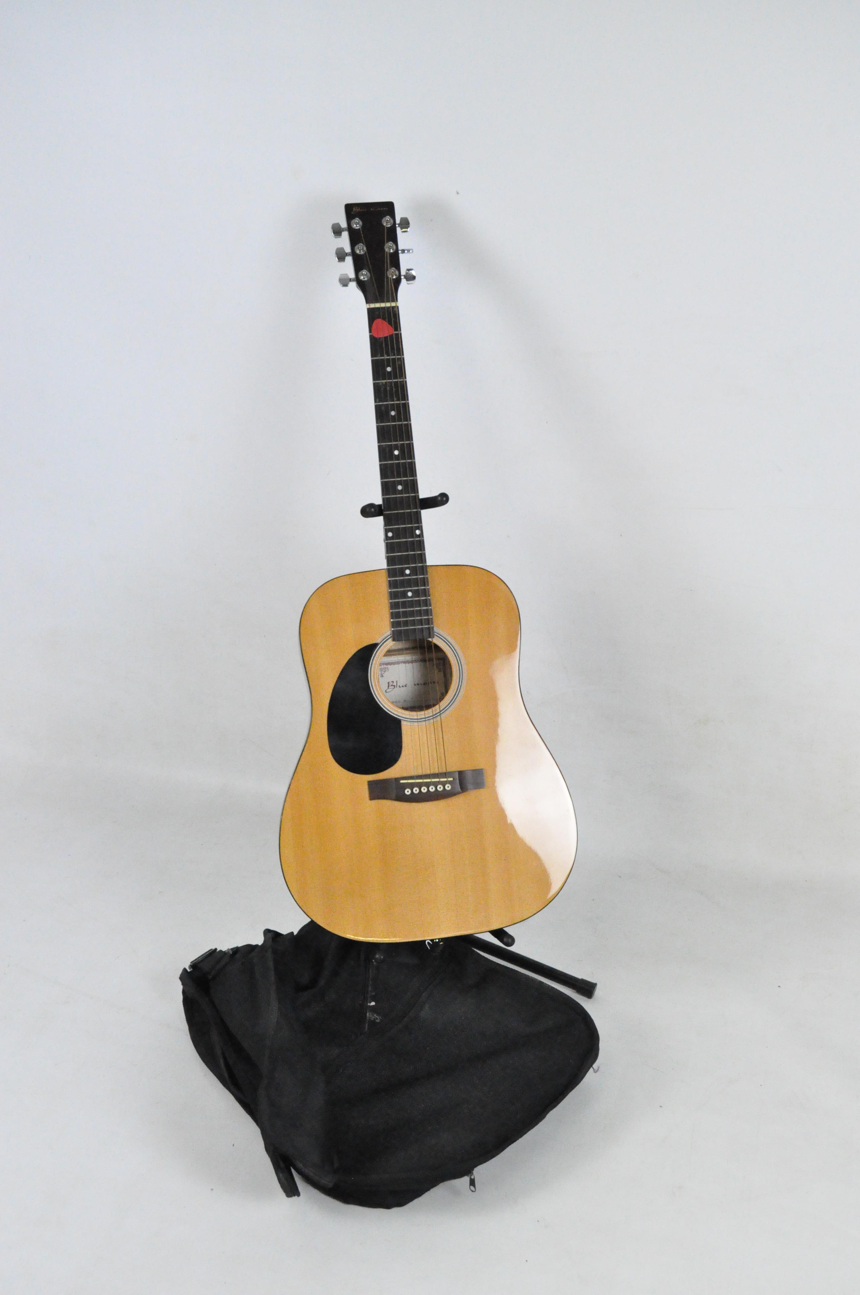 A Blue Moon left handed guitar, with a case and stand,