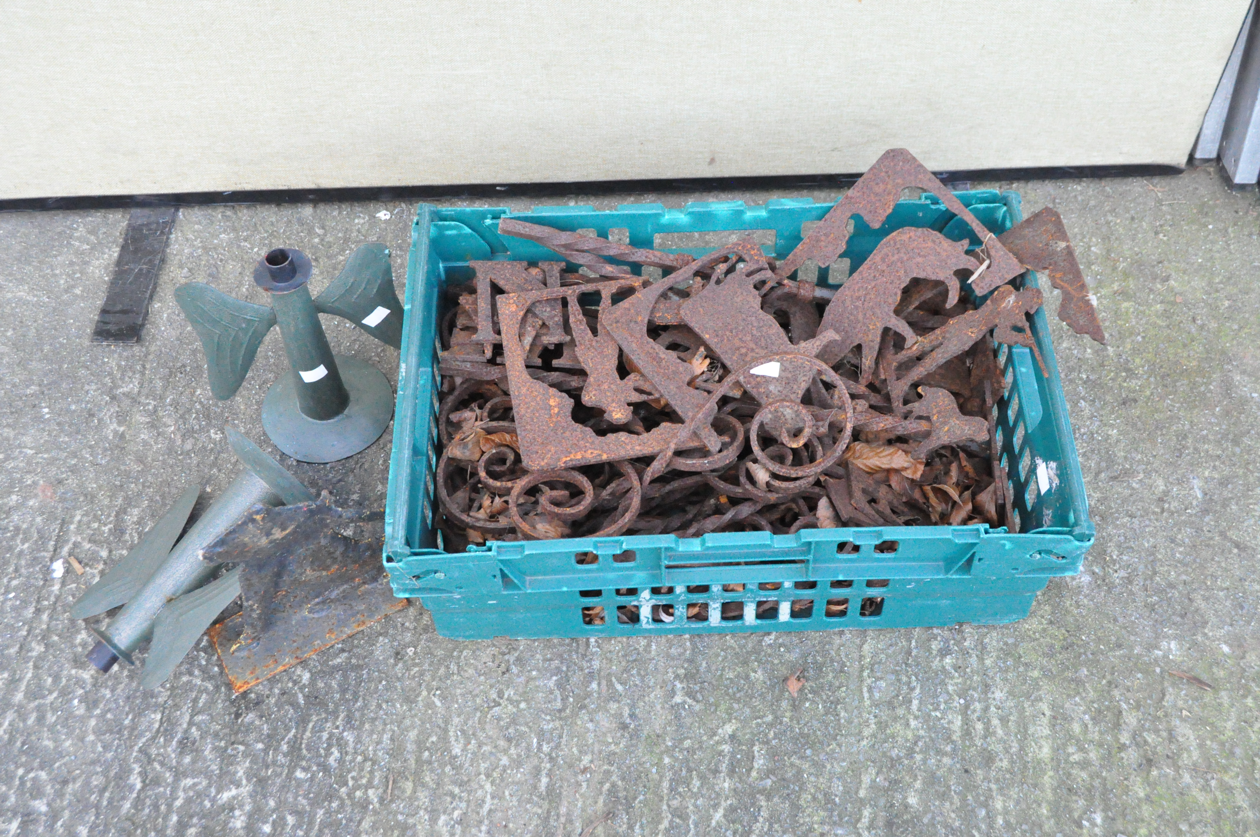 A large collection of cast metal weather vane parts and letters of various designs