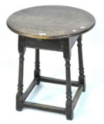 An early 20th century small oak circular occasional table