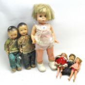 A selection of assorted vintage dolls,