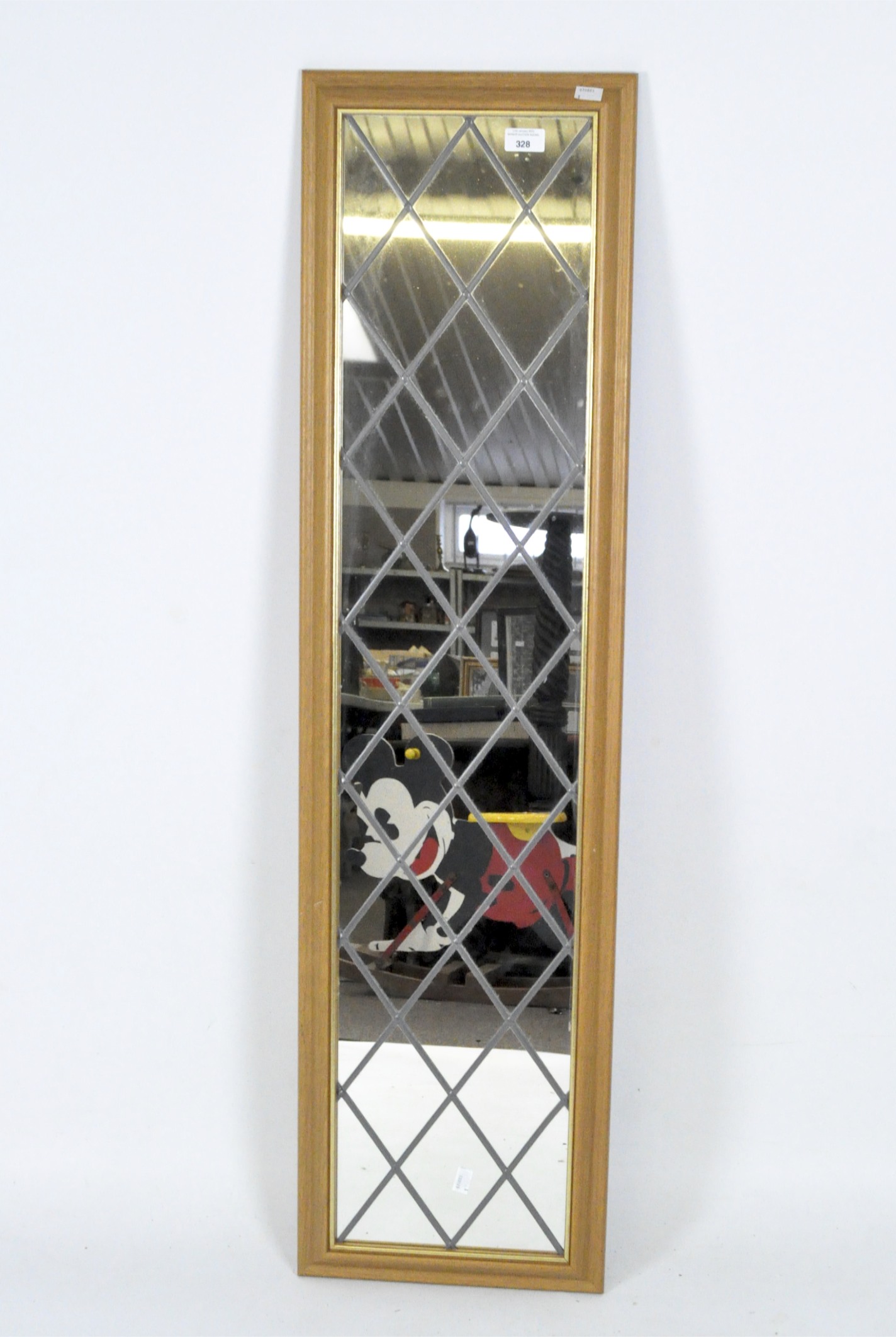 A late 20th century wall mirror, with simulated leaded panels,