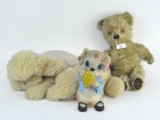 A vintage poodle soft toy, a teddy bear and a plastic dog