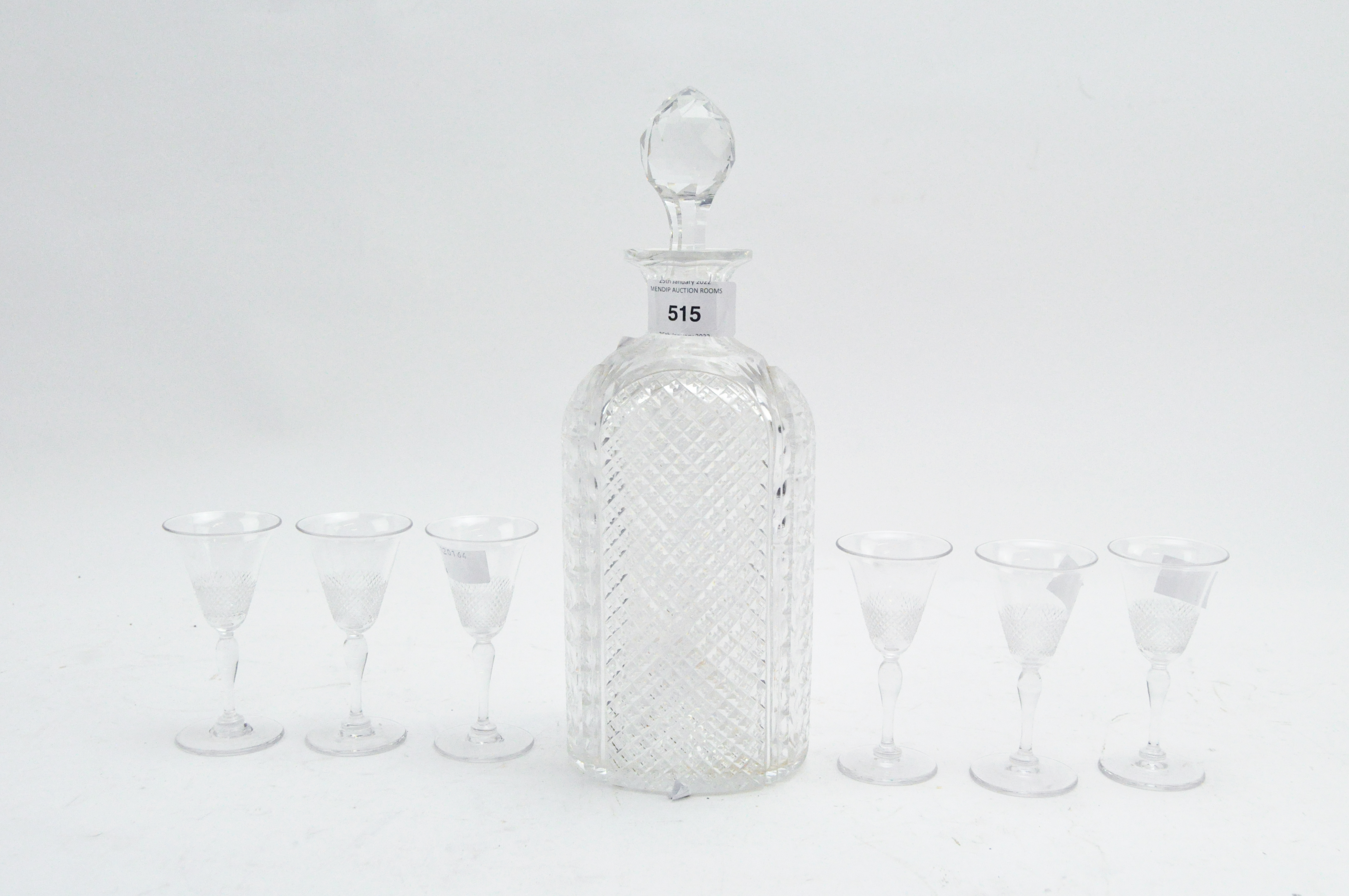 A cut glass liqueur set with decanter and glasses