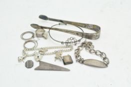 A pair of silver sugar tongs and a quantity of silver jewellery,