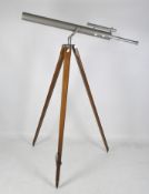A contemporary Dolland 'Astra' telescope on a wooden tripod stand,