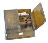 An early 20th century oak stationary box,