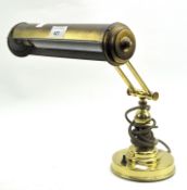 A vintage adjustable brass desk lamp,