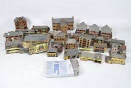 A large collection of vintage cardboard model railway related buildings