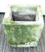 A reconstituted stone garden planter,