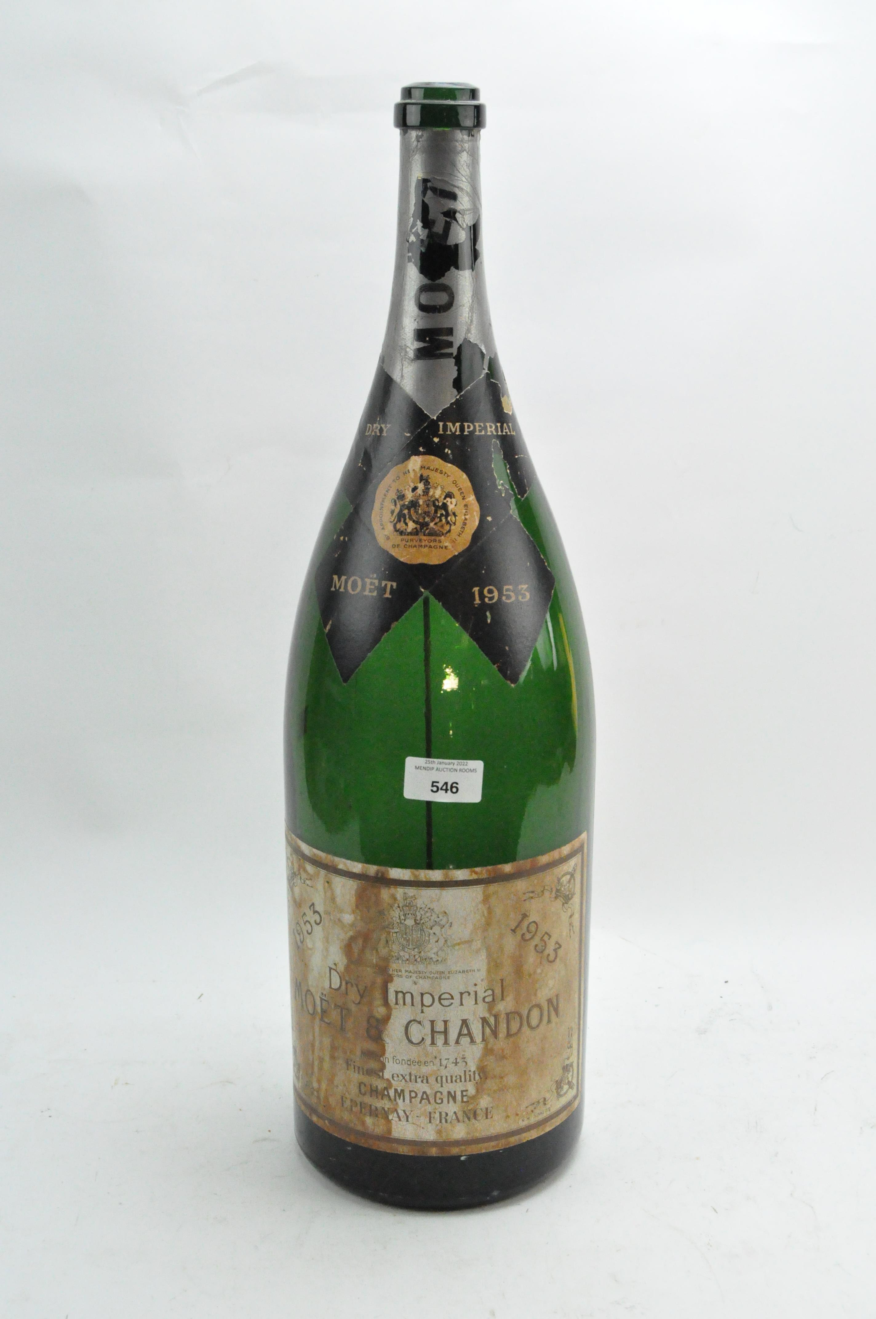 An empty 1953 oversized bottle of Moet et Chandon Champagne,