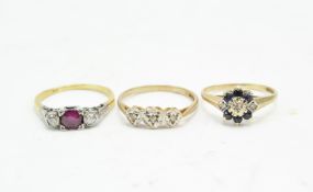 Three 20th century diamond rings, including a 9ct three stone diamond ring,