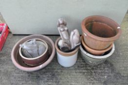 Selection of garden pots and two wood female figures