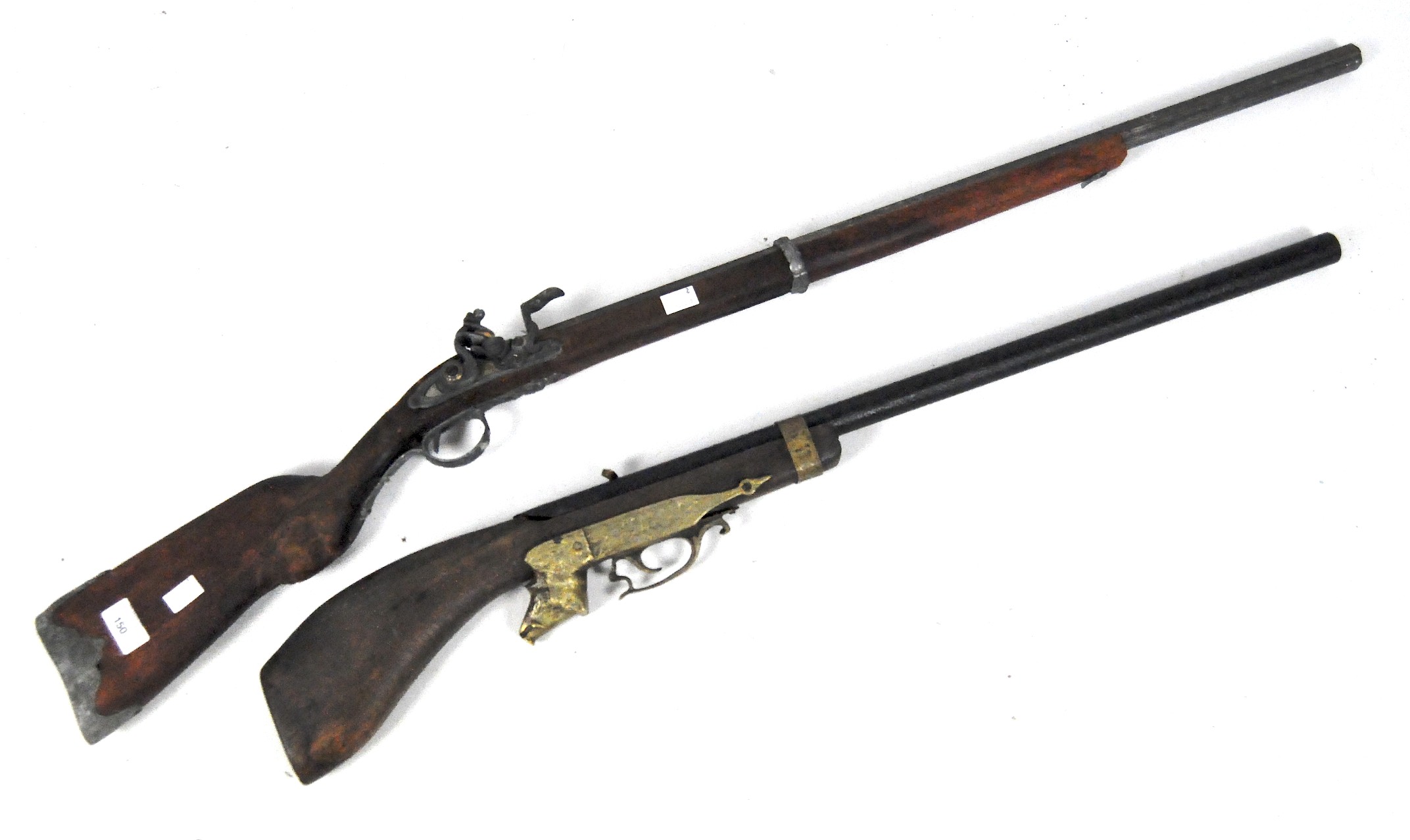 Two 20th century reproduction rifles, the first marked 'Paris' with scroll cast white metal mounts,