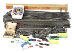 A quantity of vintage model railway track and related collectables,