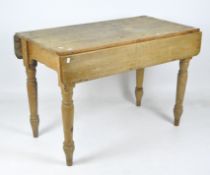 A late 19th century pine farmhouse table drop leaf table,