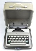 A vintage Olympia typewriter in original carry case
