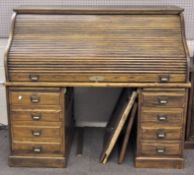 A large modern oak veneered roll top desk,