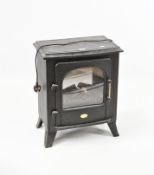 A black Dimplex electric stove in the style of a woodburning stove,