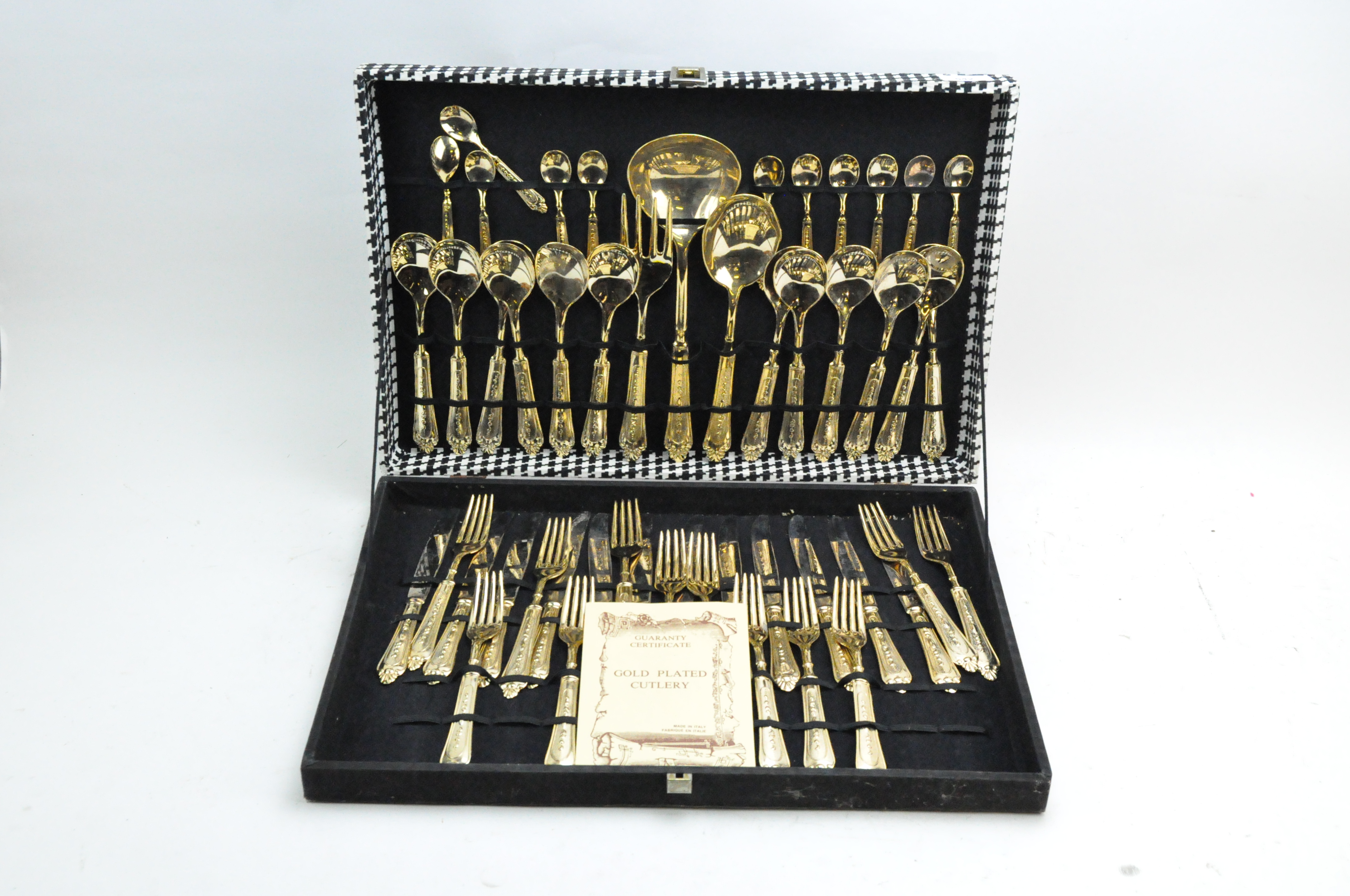 A contemporary canteen of gold plated cutlery,