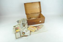 A wooden box containing 19th and 20th century Christmas cards and ephemera.