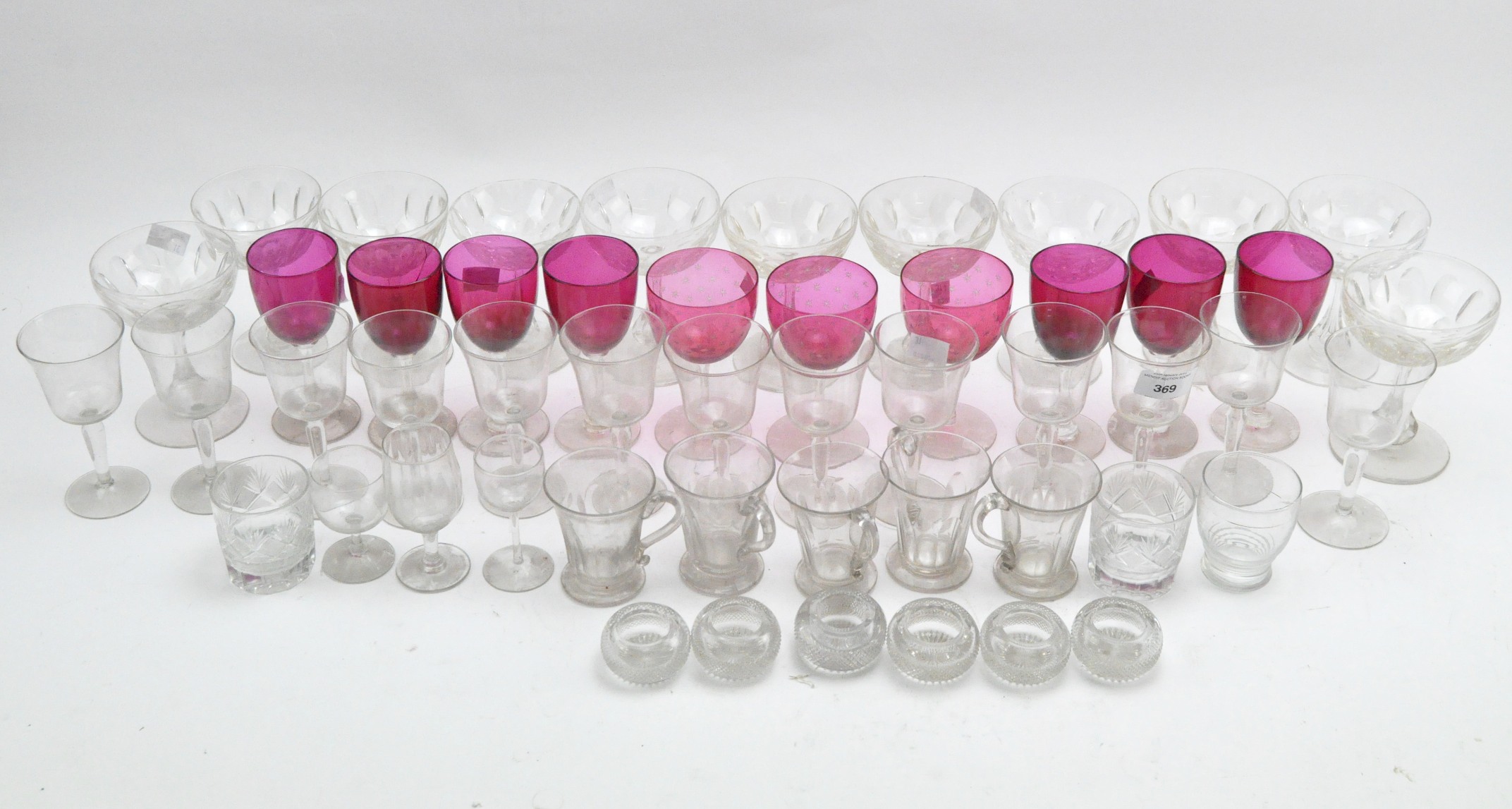 A collection of assorted drinking glasses,