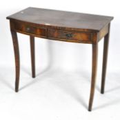 A 20th century mahogany drop leaf table,