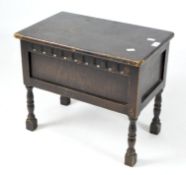 A stained oak small sewing box, 20th century, in the style of coffer,