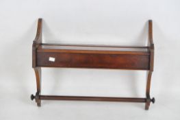 A late 19th/early 20th century mahogany towel rail,