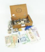 A collection of coins and notes, pendants and brooches