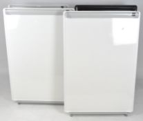 A group of four whiteboard flip charts,