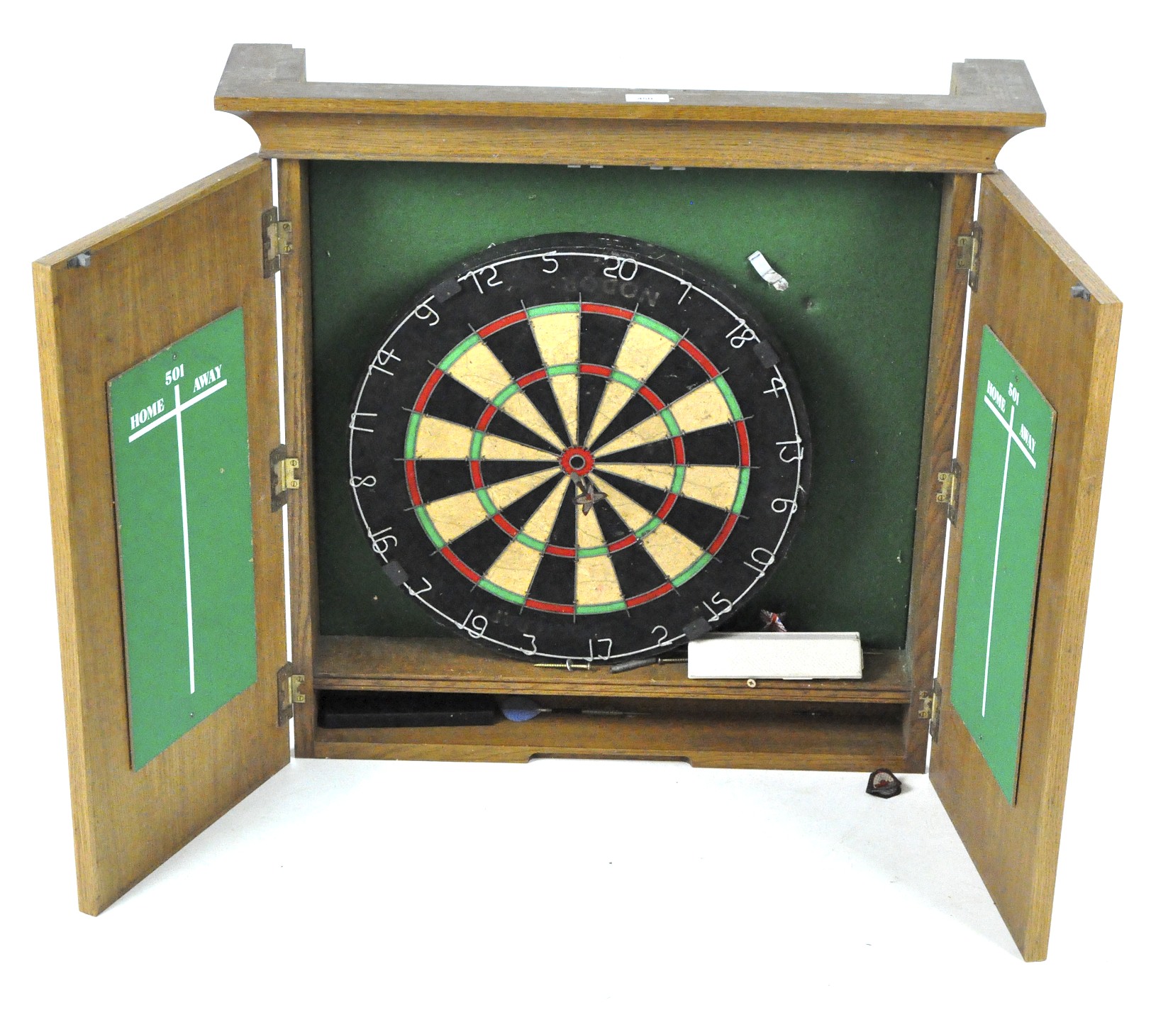 A wooden wall mounting unit containing a dart board,