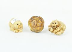Three 20th century netsukes, the two resin examples modelled as tigers,