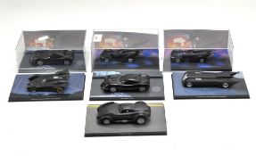 A collection of seven Batman model vehicles on original stands