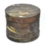 An early 20th century wooden lidded storage box of circular form,